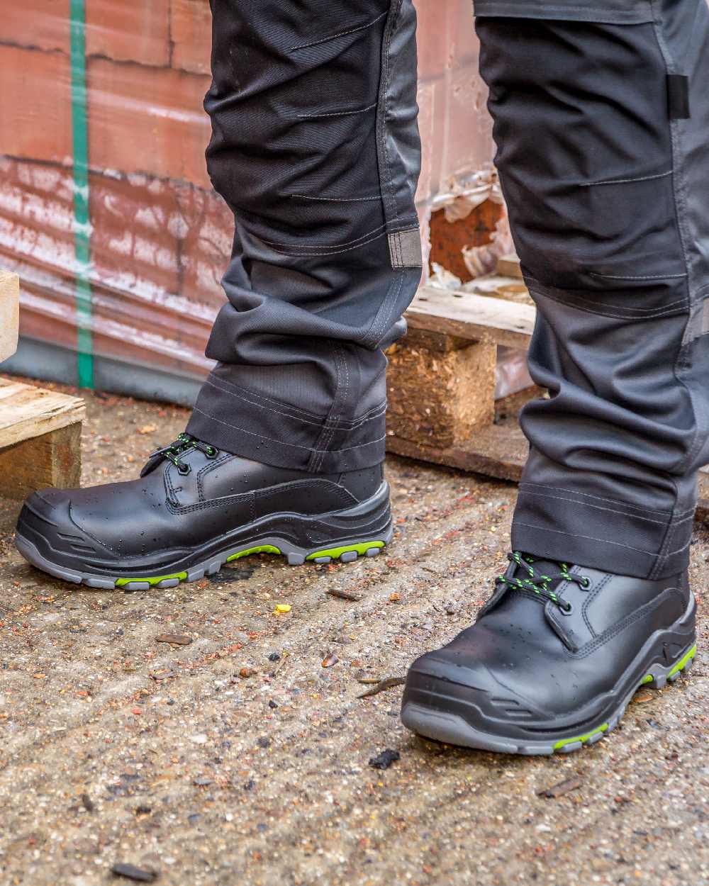 Black Coloured Apache Mens Dakota Metal Free Waterproof Safety Boots on outdoor background