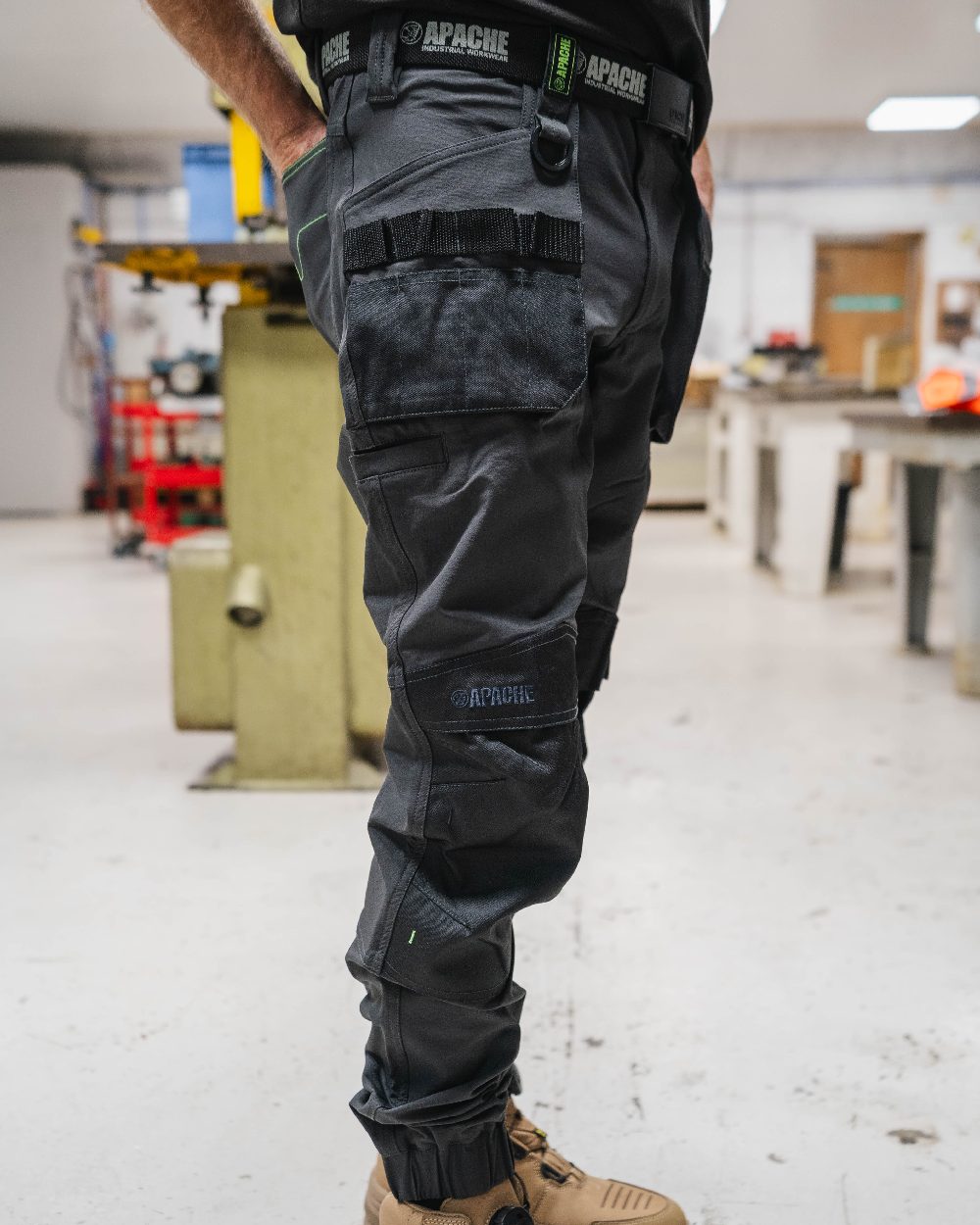 Grey Black Coloured Apache Mens Yellowknife Elasticated Hem 4 Way Stretch Trousers on office background