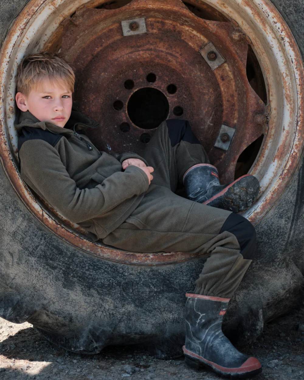 Khaki Black coloured Betacraft Childrens Quest Fleece Bushshirt on tyre background