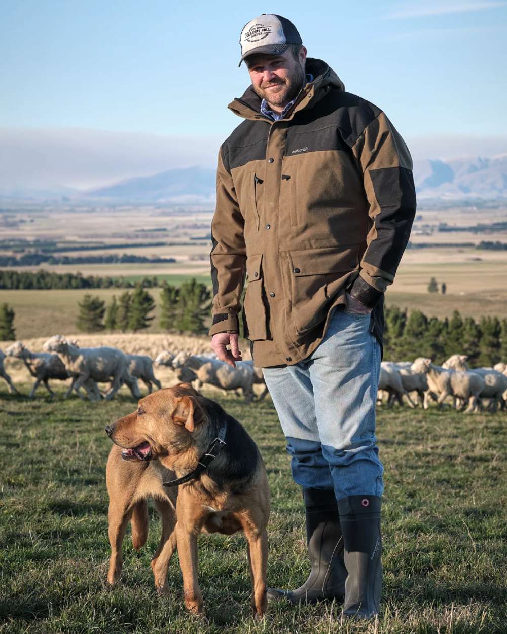 Taupe coloured Betacraft Mamaku Jacket on mountain background