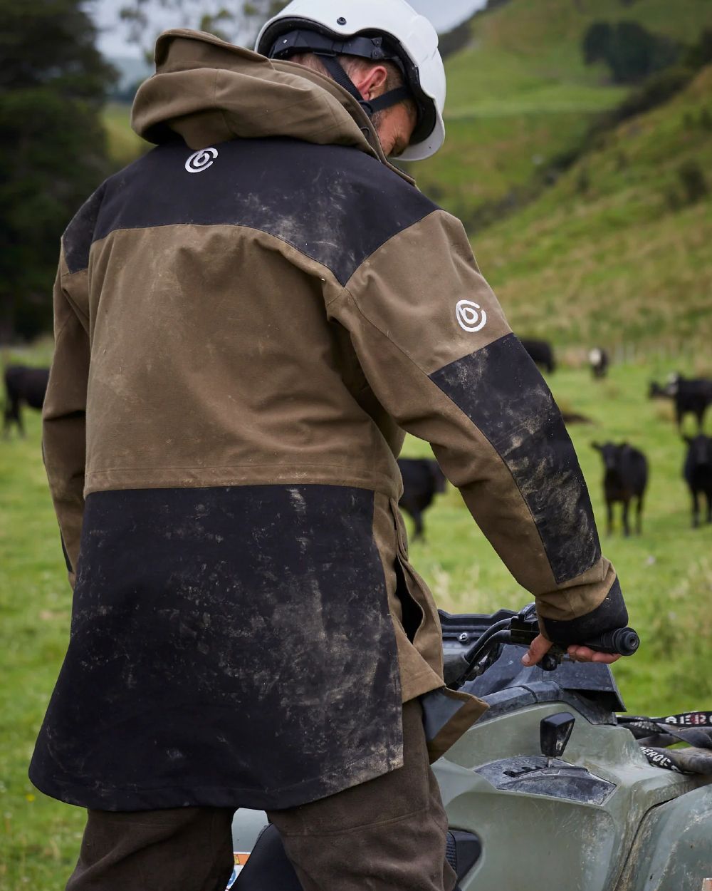 Taupe coloured Betacraft Mamaku Jacket on mountain background