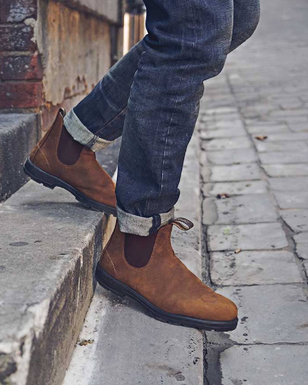 Saddle Brown coloured Blundstone 562 Saddle Brown Leather Boots on street background