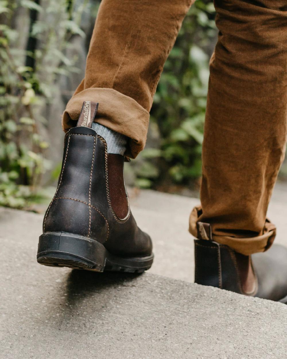 Stout Brown coloured Blundstone Original 500 Chelsea Boots on stairs background