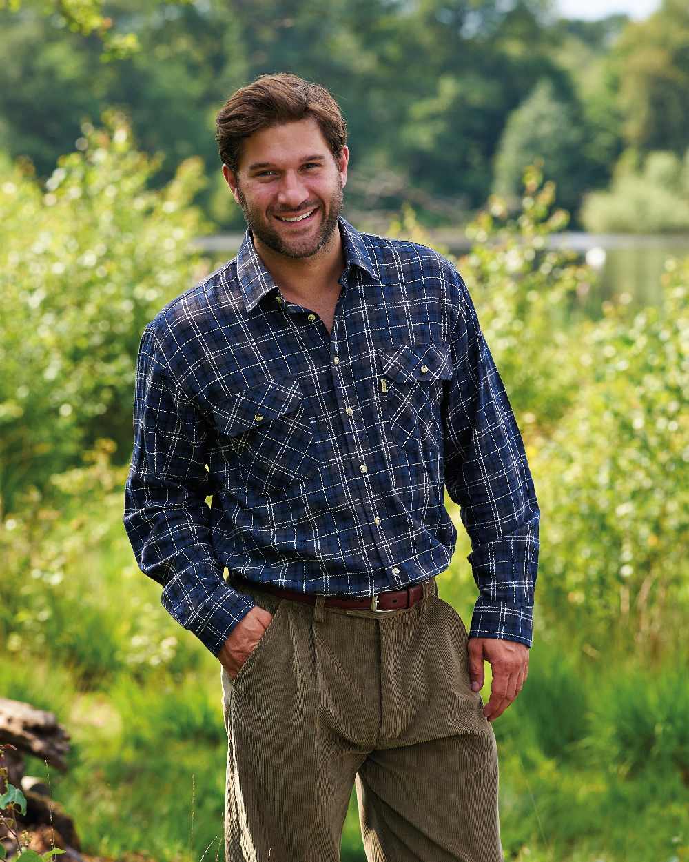Blue coloured Champion Kilbeggan Tartan Shirt on forest background