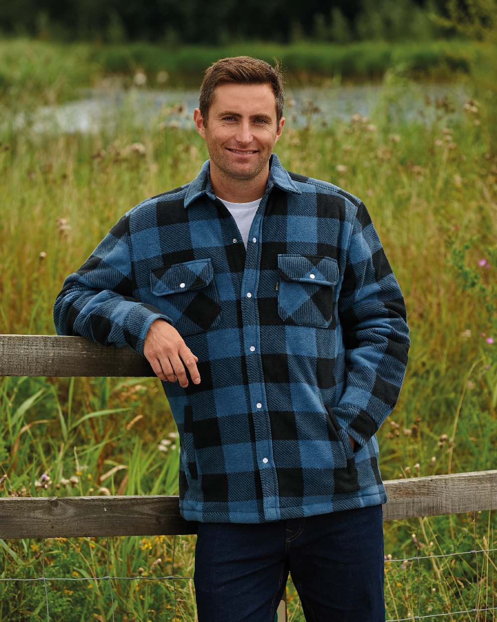 Blue coloured Champion Kinross Padded Fleece Lumberjack Shirt on forest background