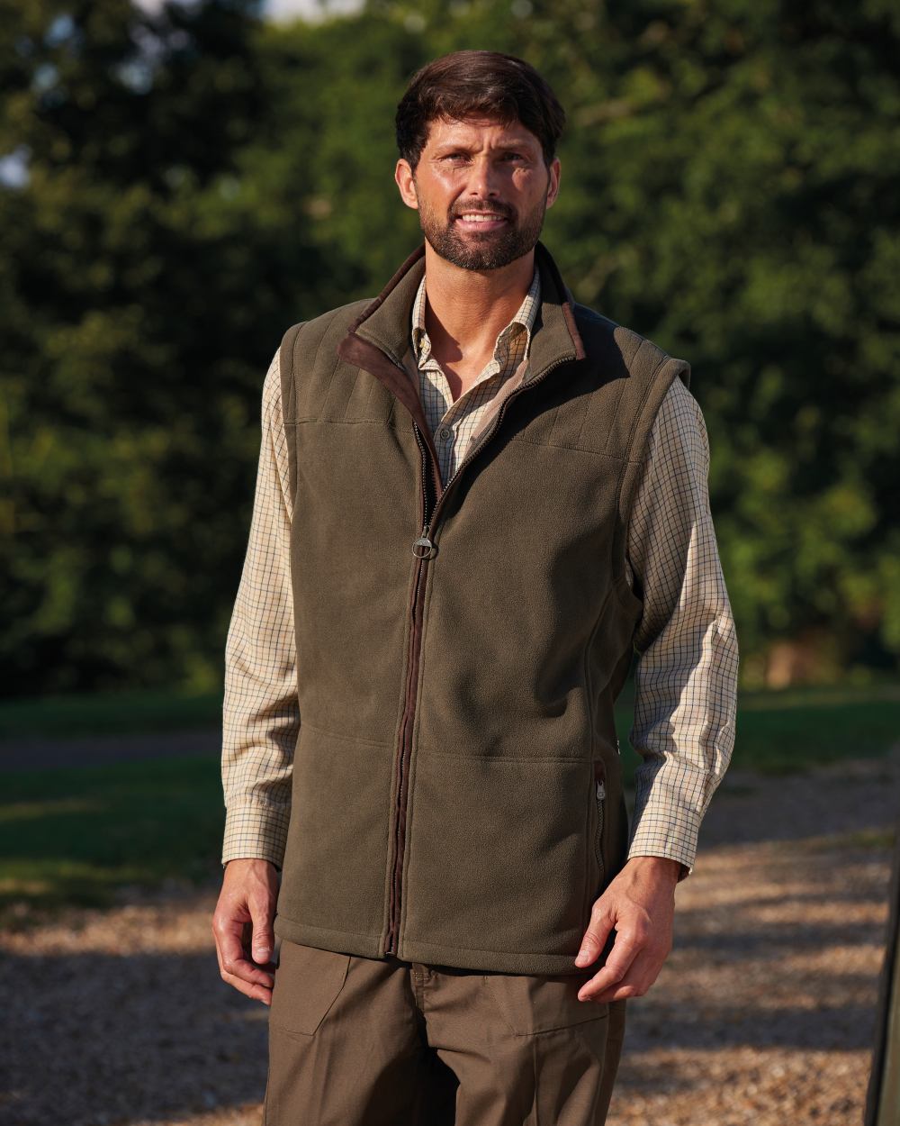 Olive coloured Champion Portree Fleece Gilet on street background