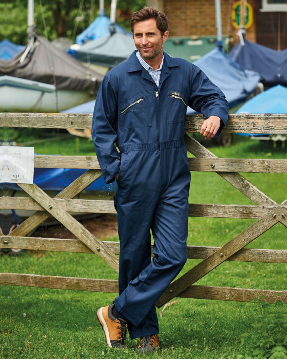 Navy coloured Champion Zipped Poly Cotton Boilersuit Overalls on farm background