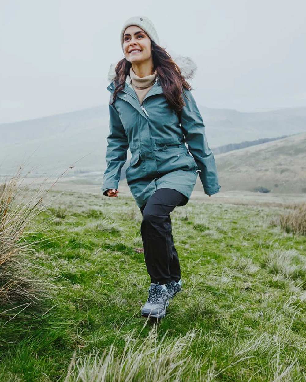 Grey/Black/Aqua coloured Cotswold Womens Abbeydale Low Hiking Shoes on grass background