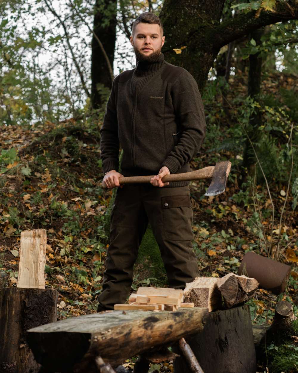 Dark Elm Melange coloured Deerhunter Carlisle Knit Cardigan With Stormliner on forest background