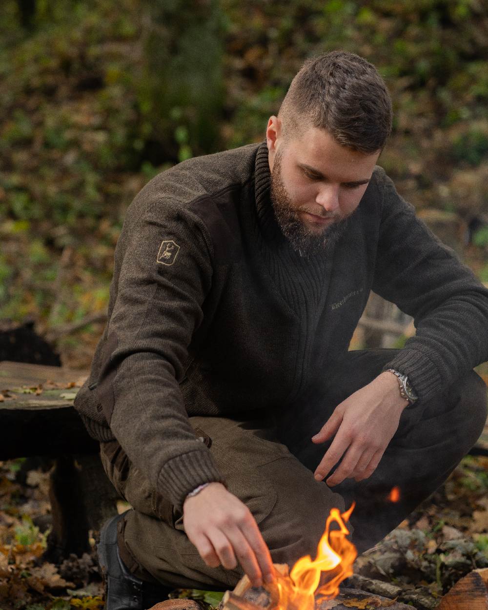 Dark Elm Melange coloured Deerhunter Carlisle Knit Cardigan With Stormliner on forest background