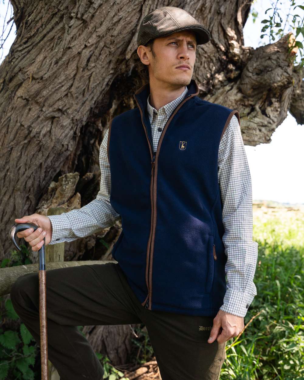 Dark Blue coloured Deerhunter Cumbria Fleece Waistcoat on forest background
