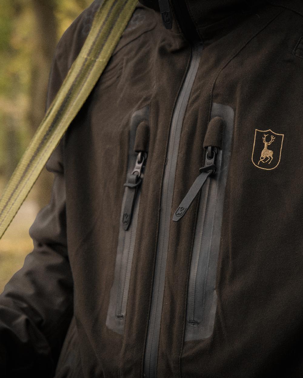 Wood coloured Deerhunter Game Pro Light Jacket on blurry background