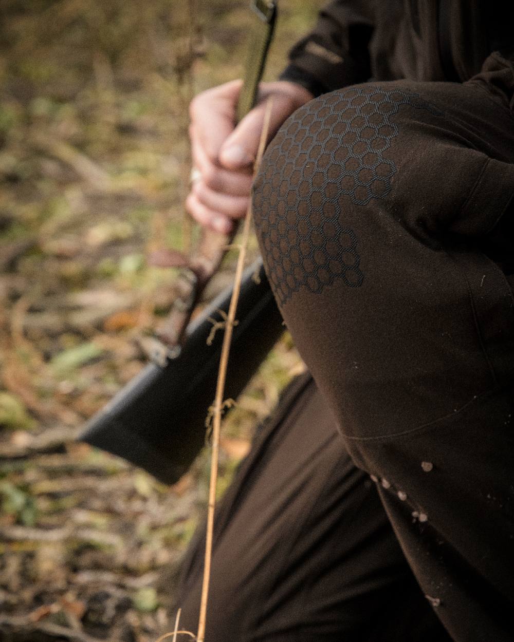 Wood coloured Deerhunter Game Pro Light Trousers on blurry background