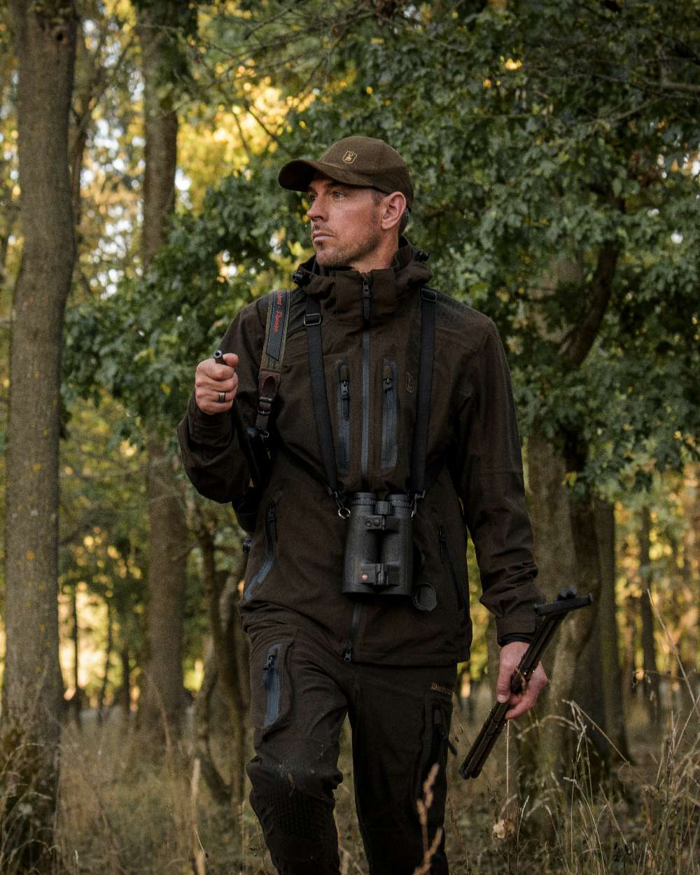 Wood coloured Deerhunter Game Pro Light Trousers on forest background
