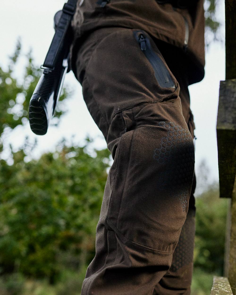 Wood coloured Deerhunter Game Pro Light Trousers on blurry background