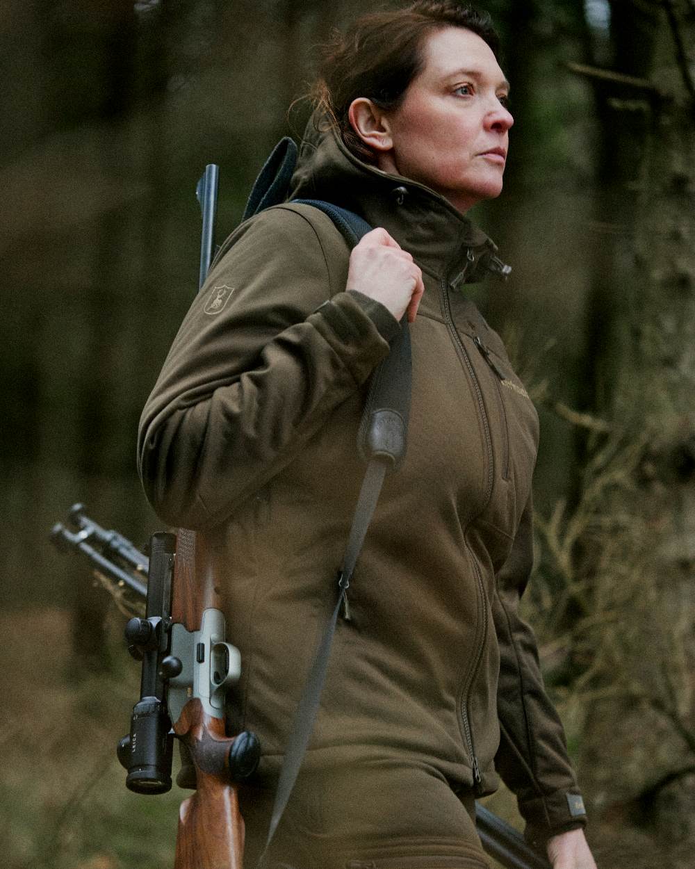 Art Green coloured Deerhunter Lady Excape Softshell Jacket on blurry background