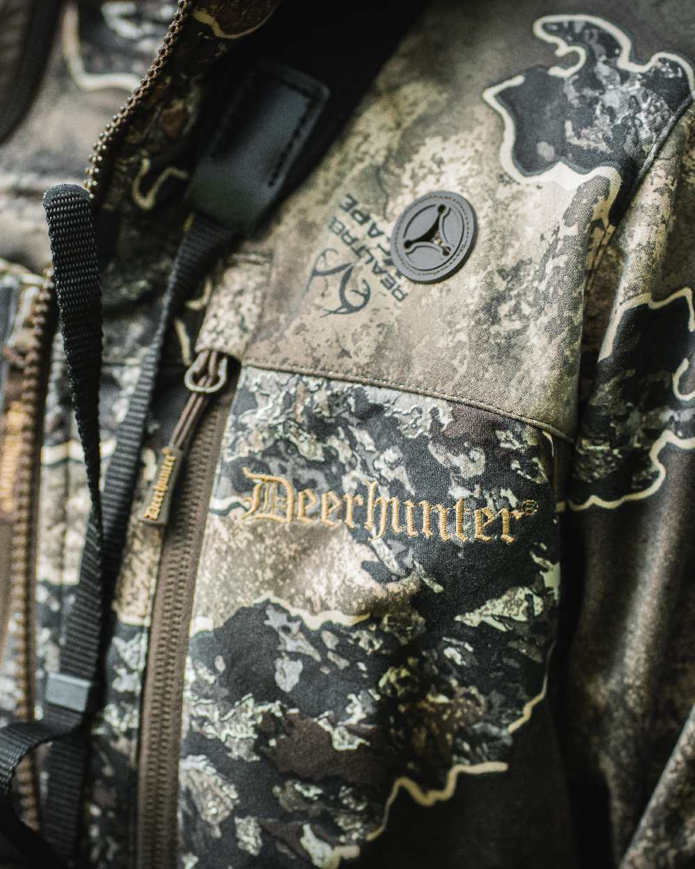 Realtree Excape coloured Deerhunter Lady Excape Softshell Jacket on blurry background