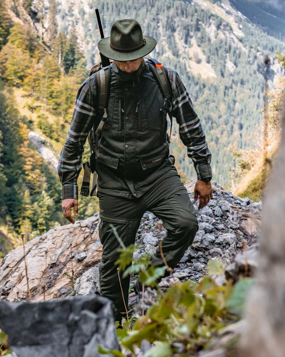 Palm Green coloured Deerhunter Strike Extreme Waistcoat on forest background
