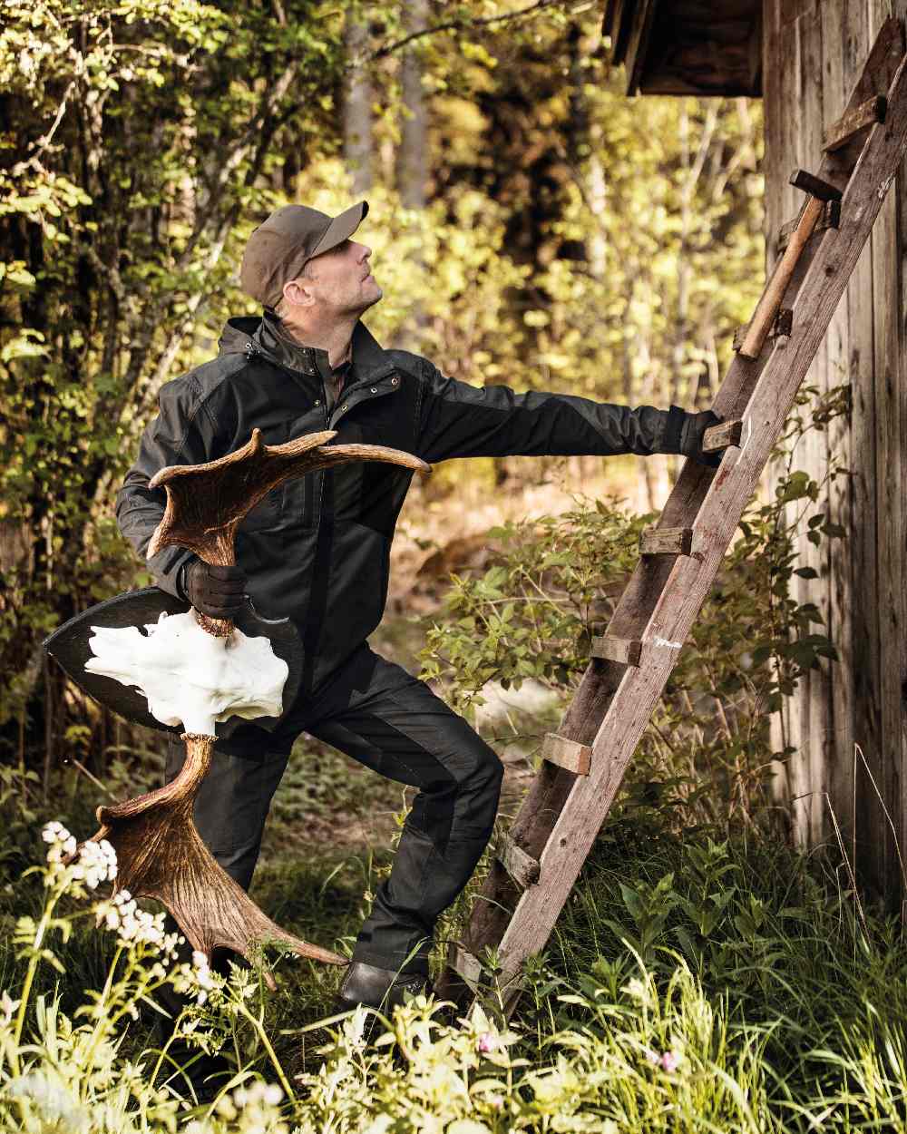 Black Ink coloured Deerhunter Strike Trousers on forest background