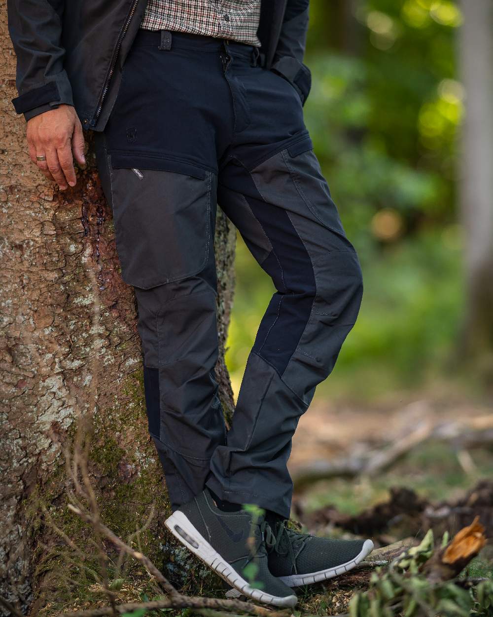 Black Ink coloured Deerhunter Strike Trousers on forest background