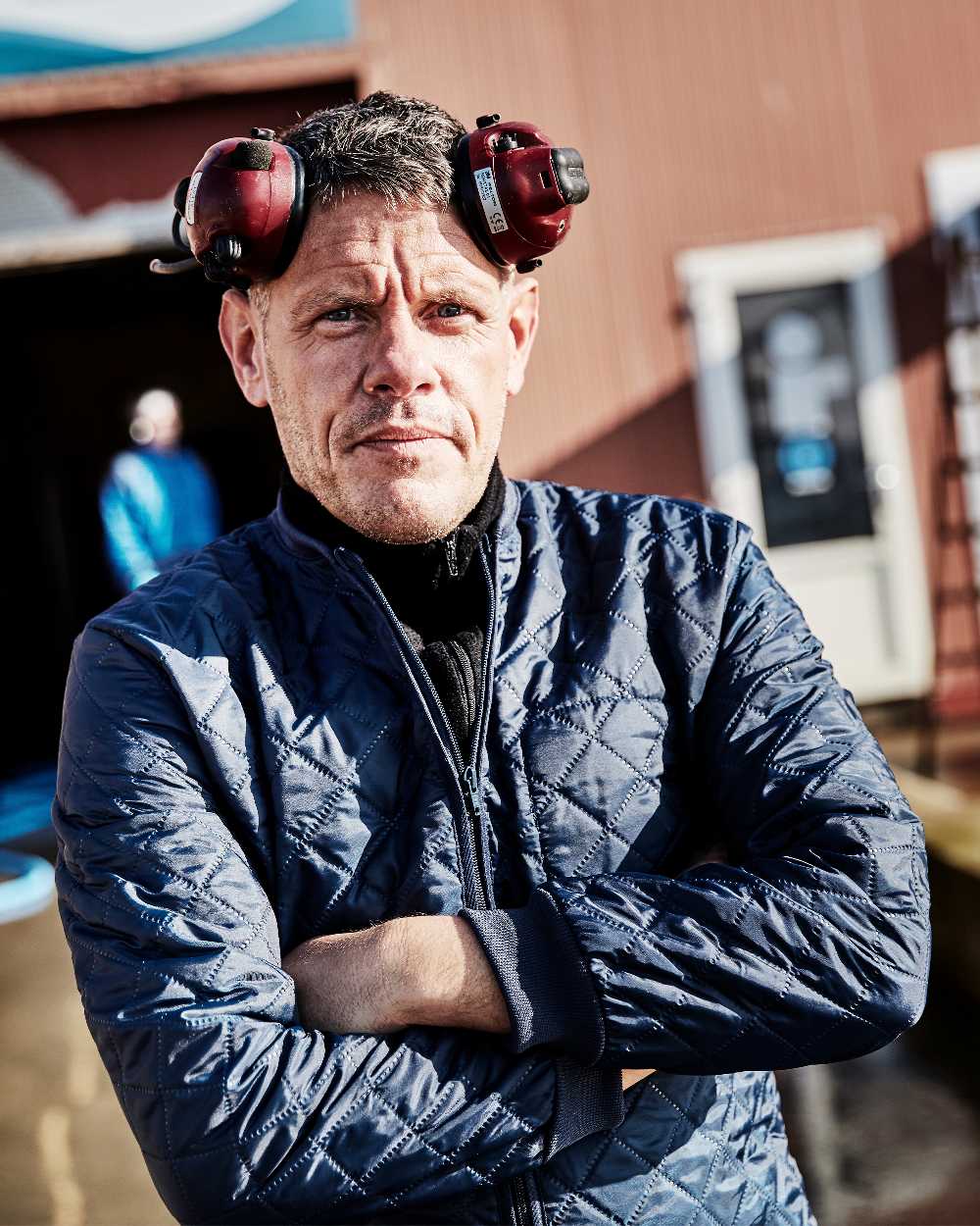 Navy Coloured Elka Mens Thermal Jacket on blurry background