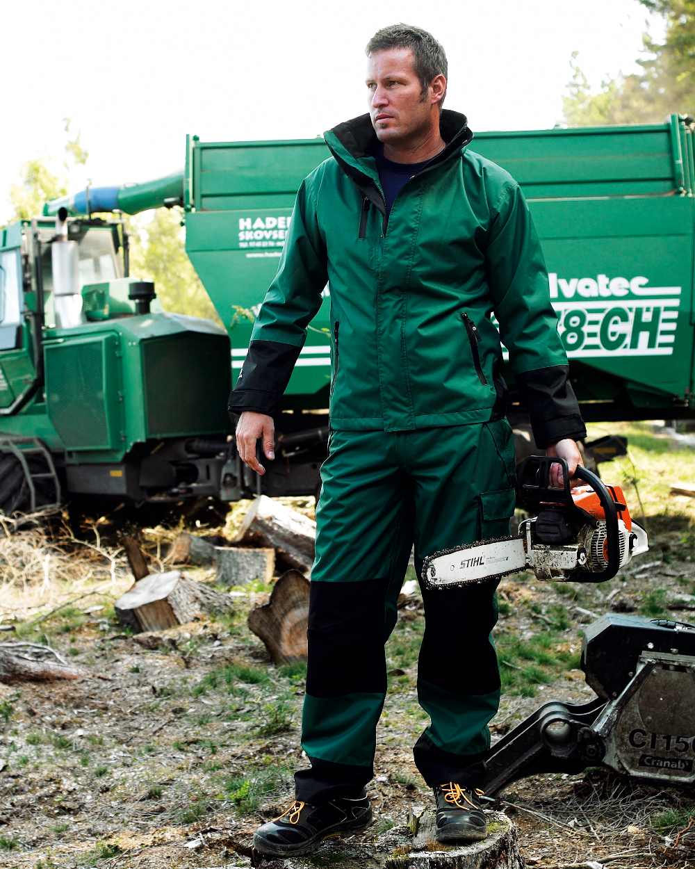 Green Black Coloured Elka Mens Working Xtreme Rain Jacket With A 2-Way Zipper on countryside background