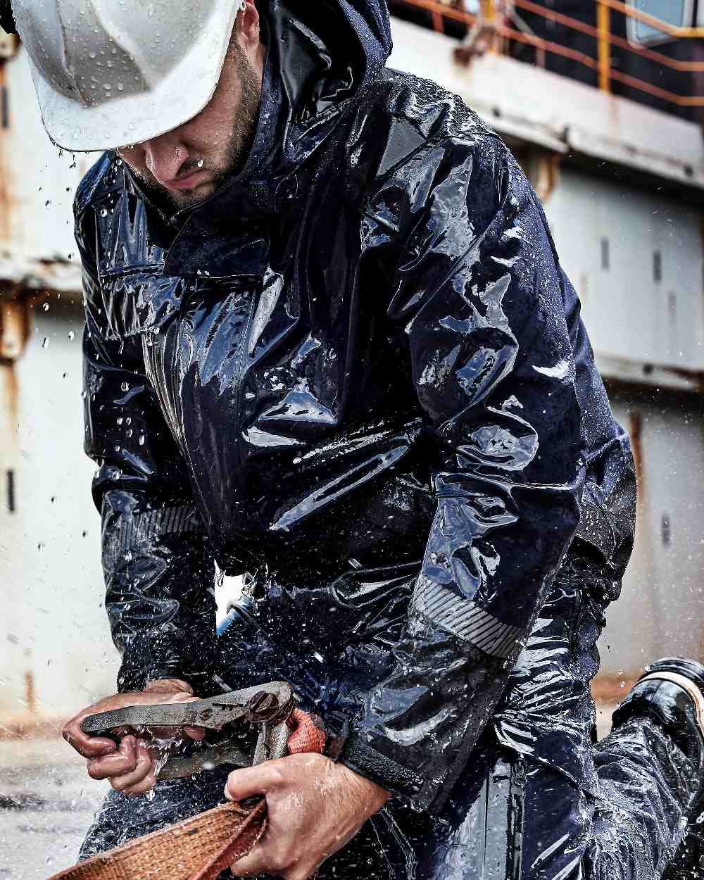 Navy Black Coloured Elka Mens Working Xtreme Stretch Jacket on construction background