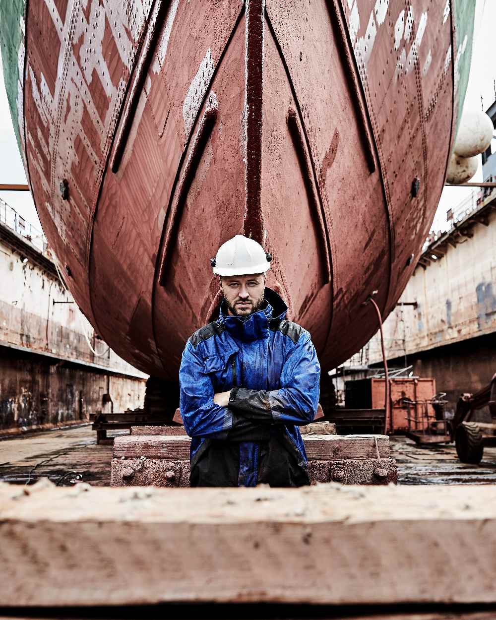 Royal Blue Black Coloured Elka Mens Working Xtreme Stretch Jacket on construction background