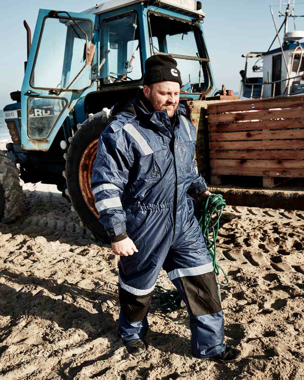 Blue Black Coloured Elka Mens Working Xtreme Winter Thermal Coverall on tractor background