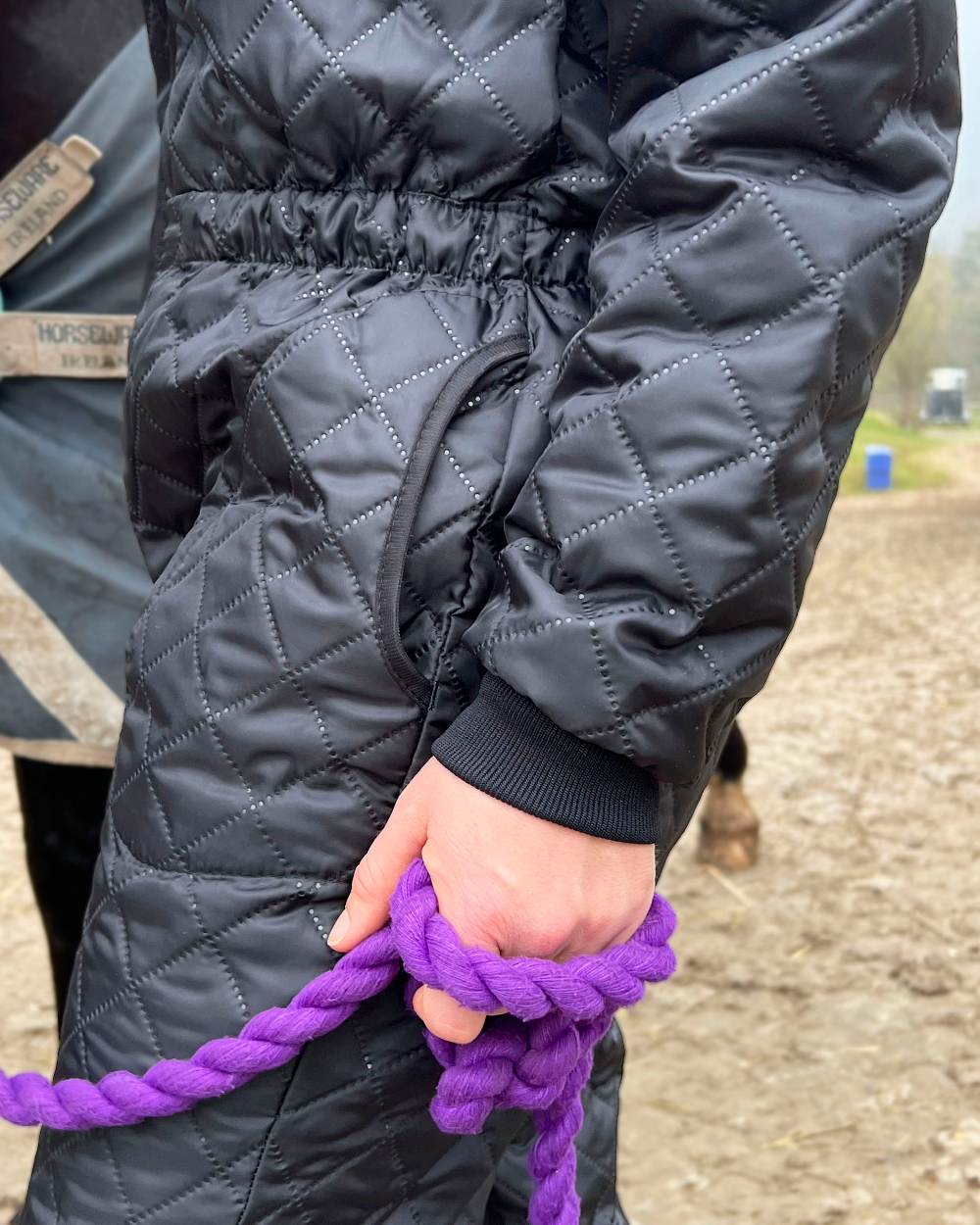 Black Coloured Elka Womens Thermal Coverall on countryside background