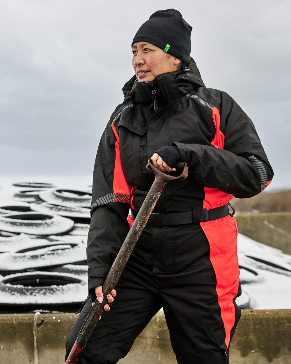 Black Red Coloured Elka Womens Working Xtreme Winter Thermal Coverall With Recycled Padding on snow background