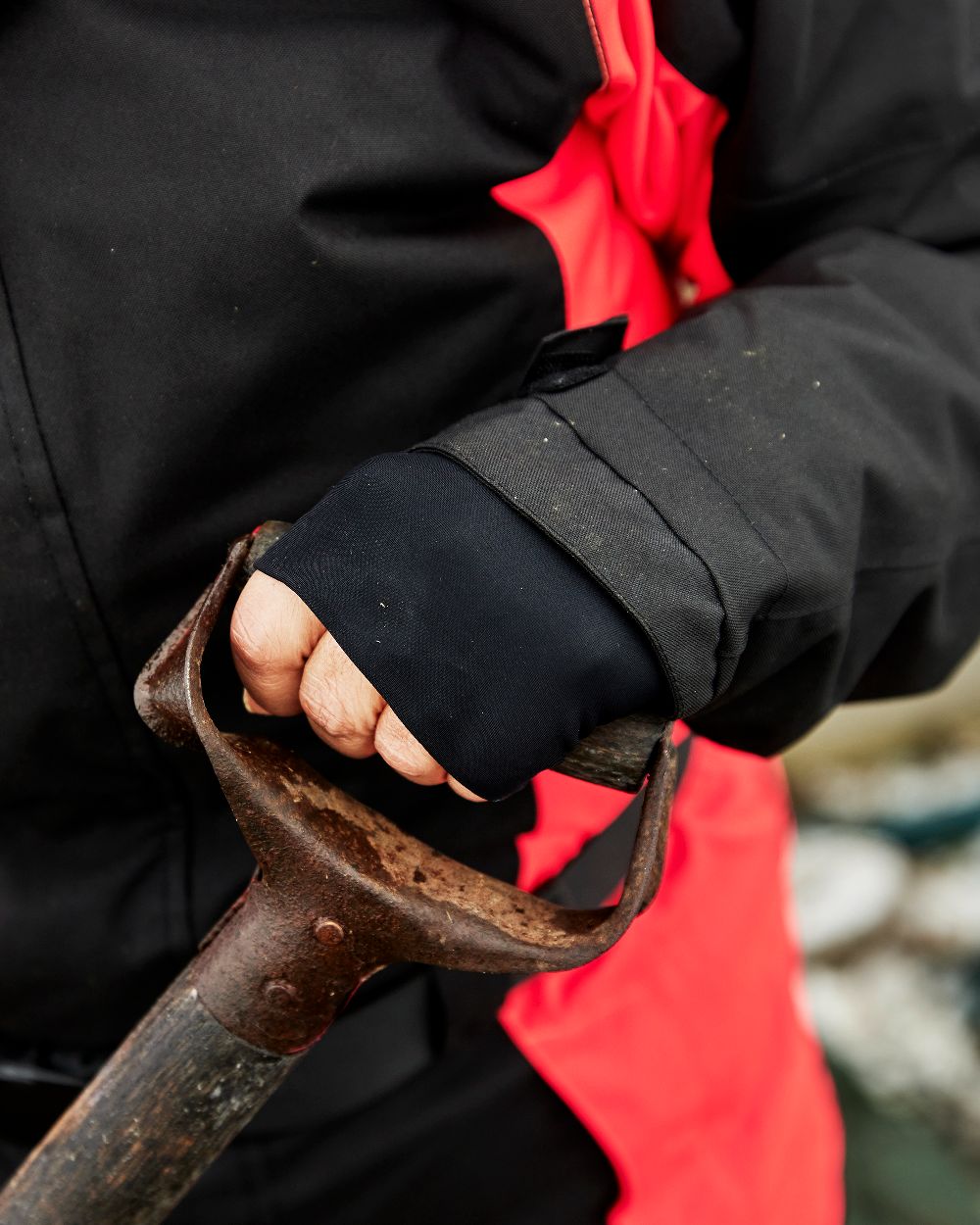 Black Red Coloured Elka Womens Working Xtreme Winter Thermal Coverall With Recycled Padding on blurry background