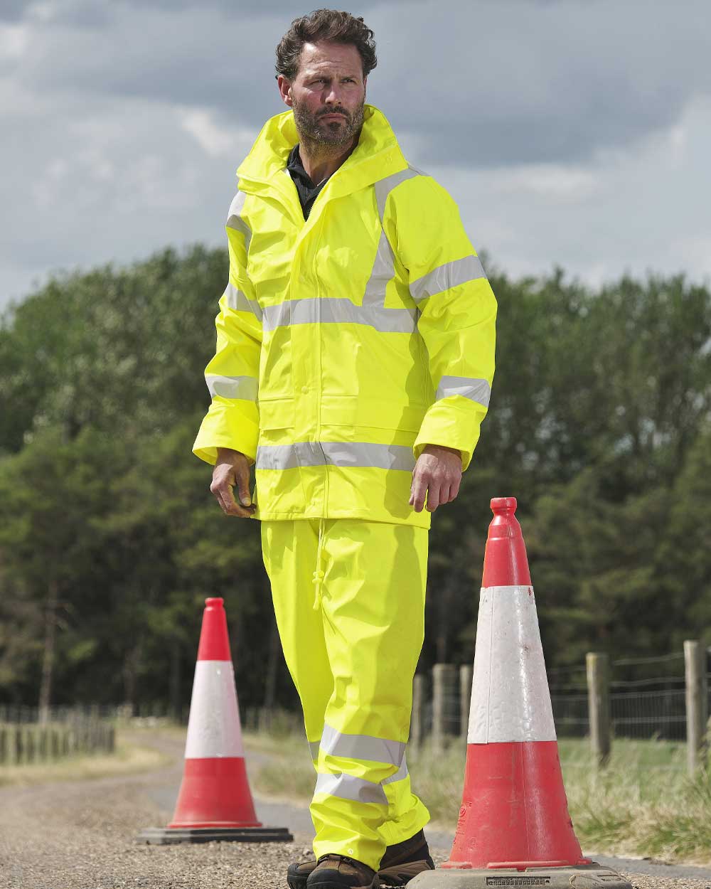 Yellow coloured Fort Air Reflex Trousers on blurry background
