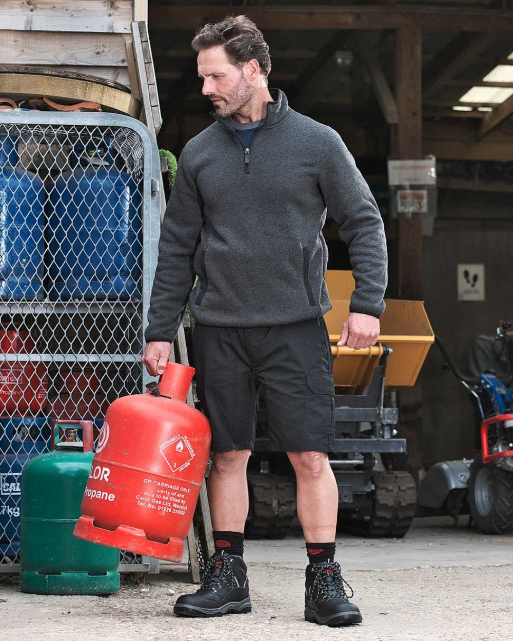 Black coloured Fort Workforce Shorts on workspace background