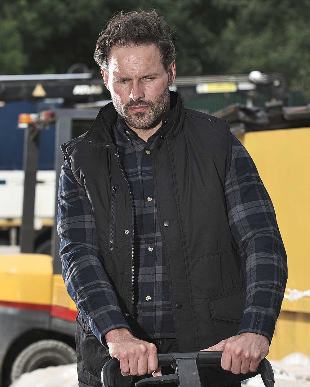 Black coloured Fort Wroxham Quilted Bodywarmer on blurry background