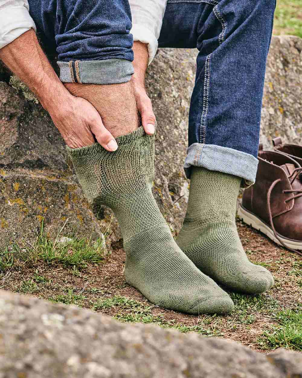 Olive coloured HJ Hall Cotton Rich Diabetic Socks on forest background