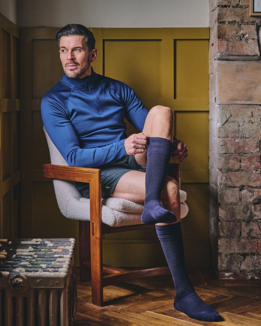 Navy coloured HJ Hall Energisox Revitalising Compression With Softop Sock on room background