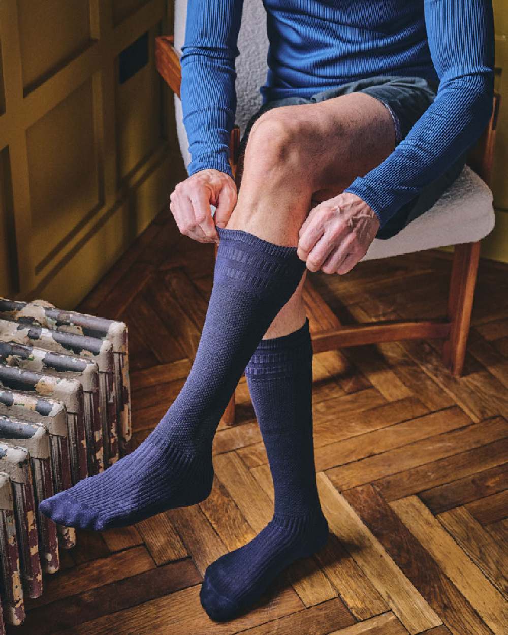 Navy coloured HJ Hall Energisox Revitalising Compression With Softop Sock on room background