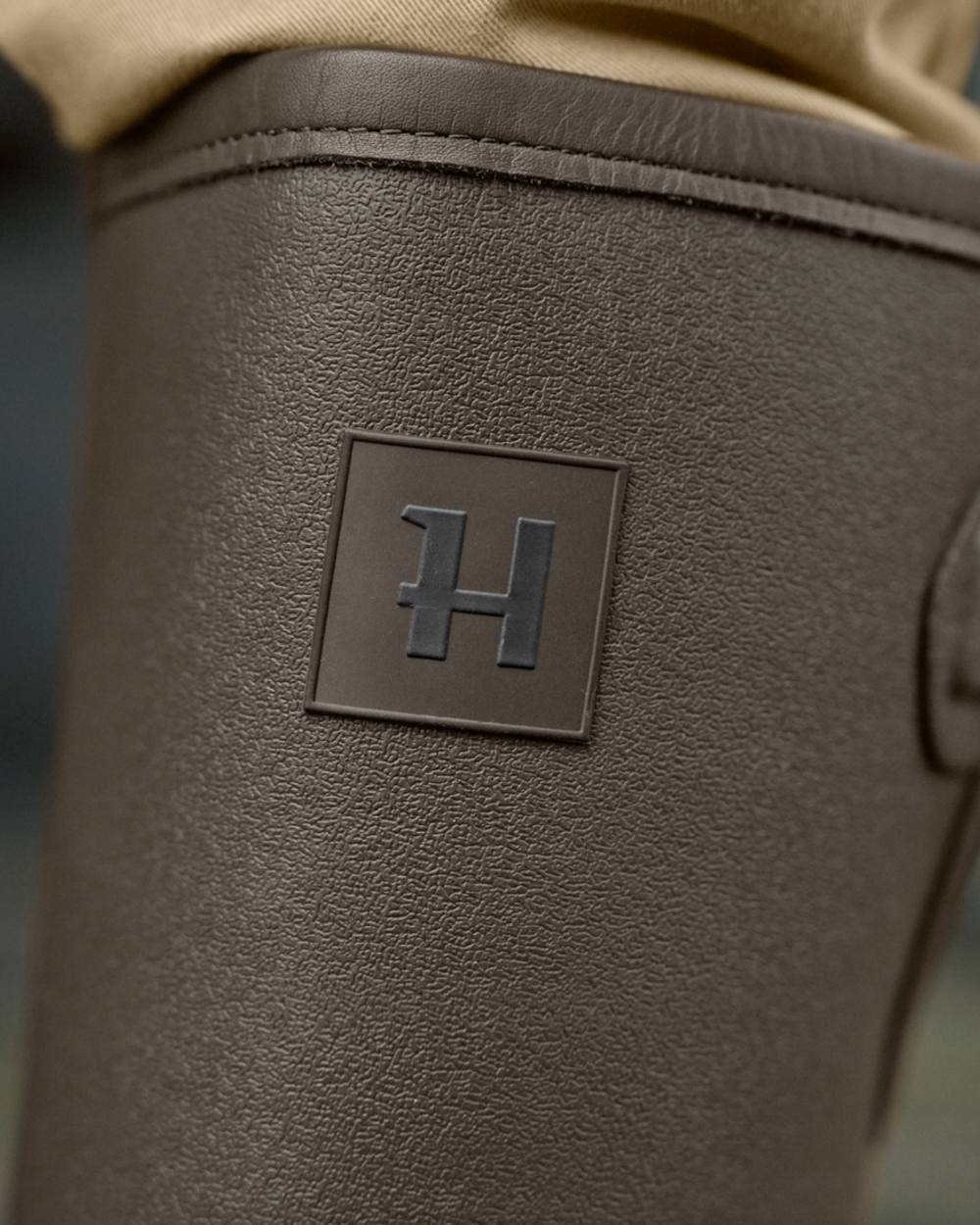 Dark Willow Green Coloured Harkila Forester Gusset Rubber Boots on outdoor background