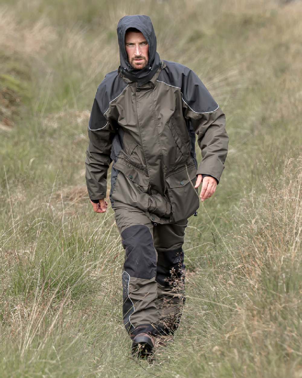 Dark Olive Coloured Hoggs of Fife Field Tech Waterproof Trousers on land background