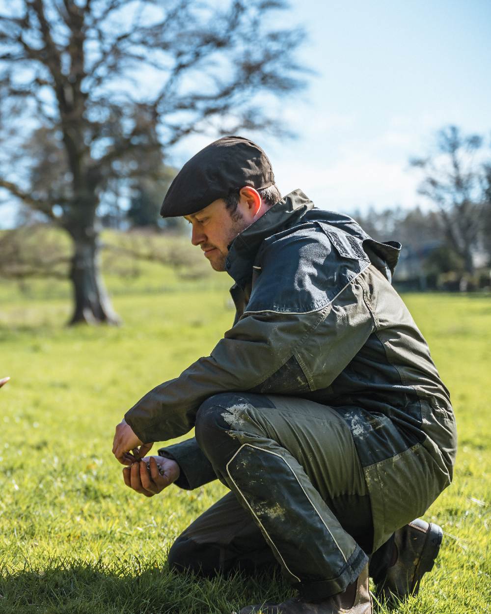Dark Olive Coloured Hoggs of Fife Field Tech Waterproof Trousers on forest background