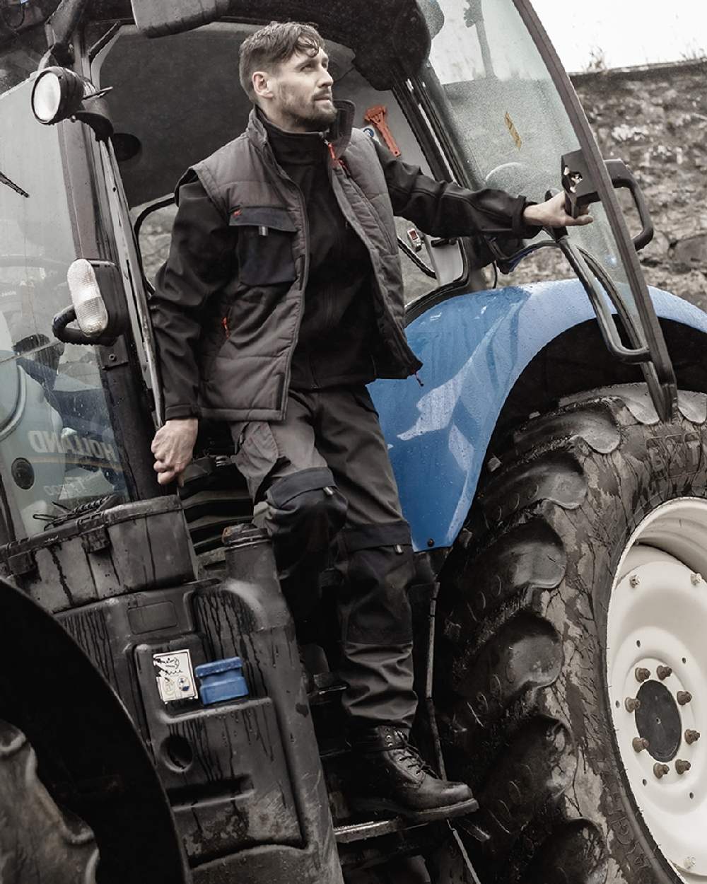 Charcoal Black Coloured Hoggs of Fife Granite II Utility Thermal Trousers on tractor background