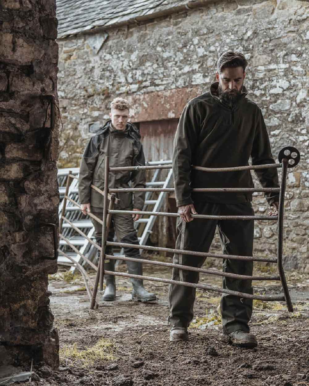 Green Coloured Hoggs of Fife Green King II 1/4 Zip Bonded Fleece on house background