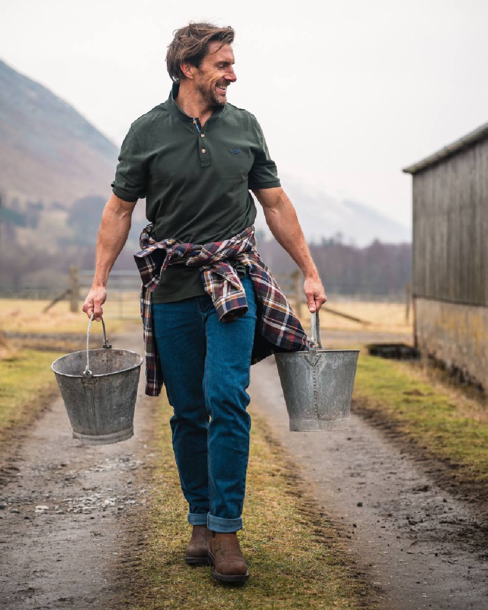 Forest Coloured Hoggs of Fife Mens Newton Pique Polo Shirt on countryside background