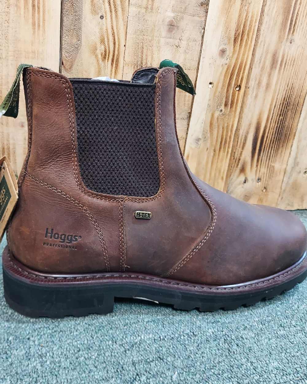 Crazy Horse Brown Coloured Hoggs of Fife Shire Pro Waterproof Dealer Boots on wood background