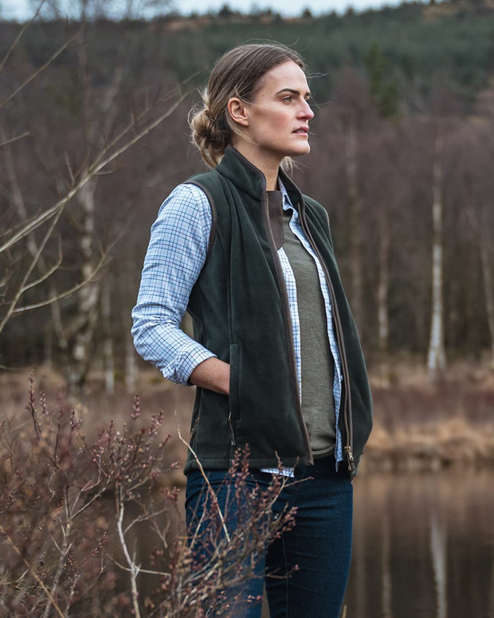 Pine Green Coloured Hoggs of Fife Stenton Ladies Fleece Gilet on lake background