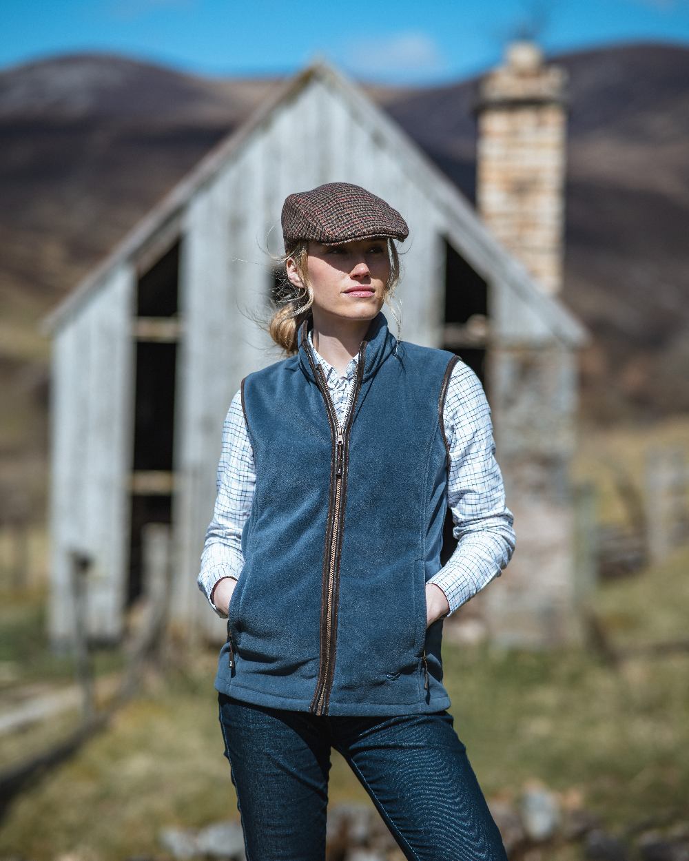 Slate Grey Coloured Hoggs of Fife Stenton Ladies Fleece Gilet on countryside background