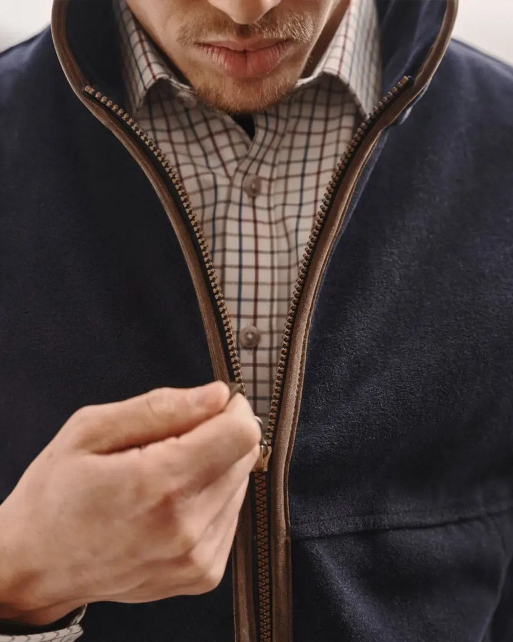 Midnight Navy coloured Hoggs of Fife Stenton Technical Fleece Gilet on blurry background