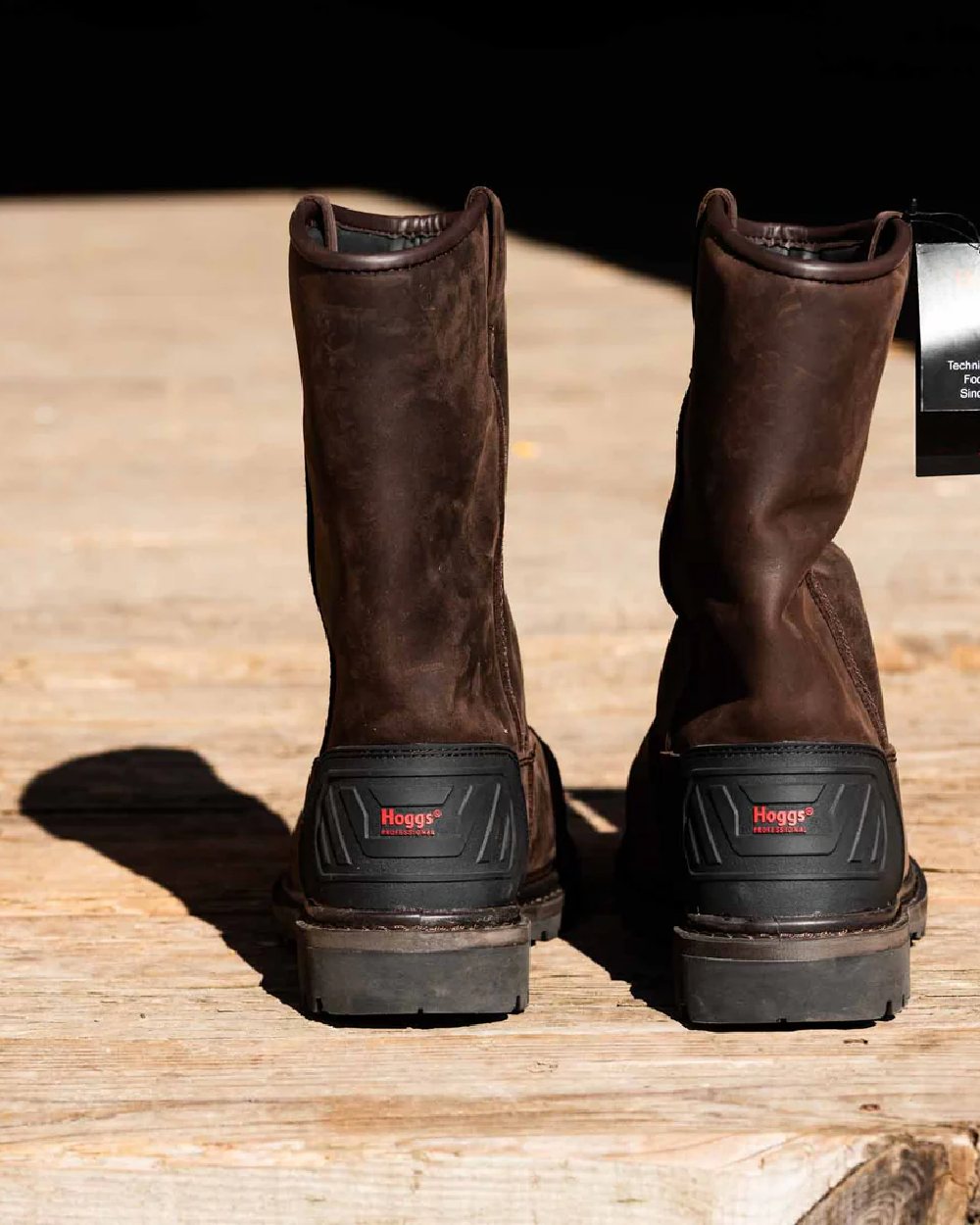 Brown Coloured Hoggs of Fife Thor Safety Rigger Boots on wood background