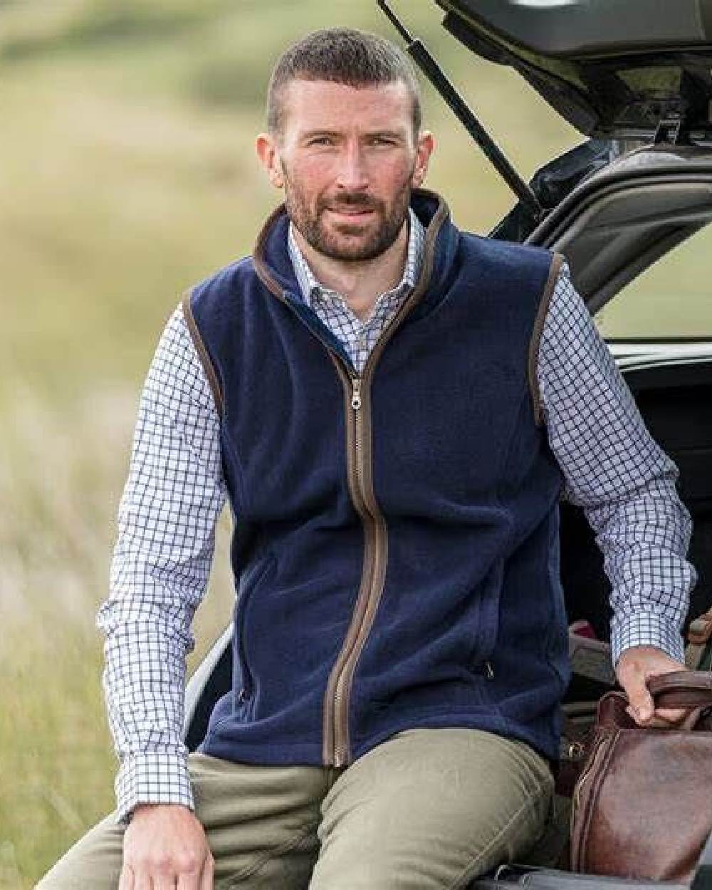 Navy Coloured Hoggs of Fife Woodhall Fleece Gilet on car background